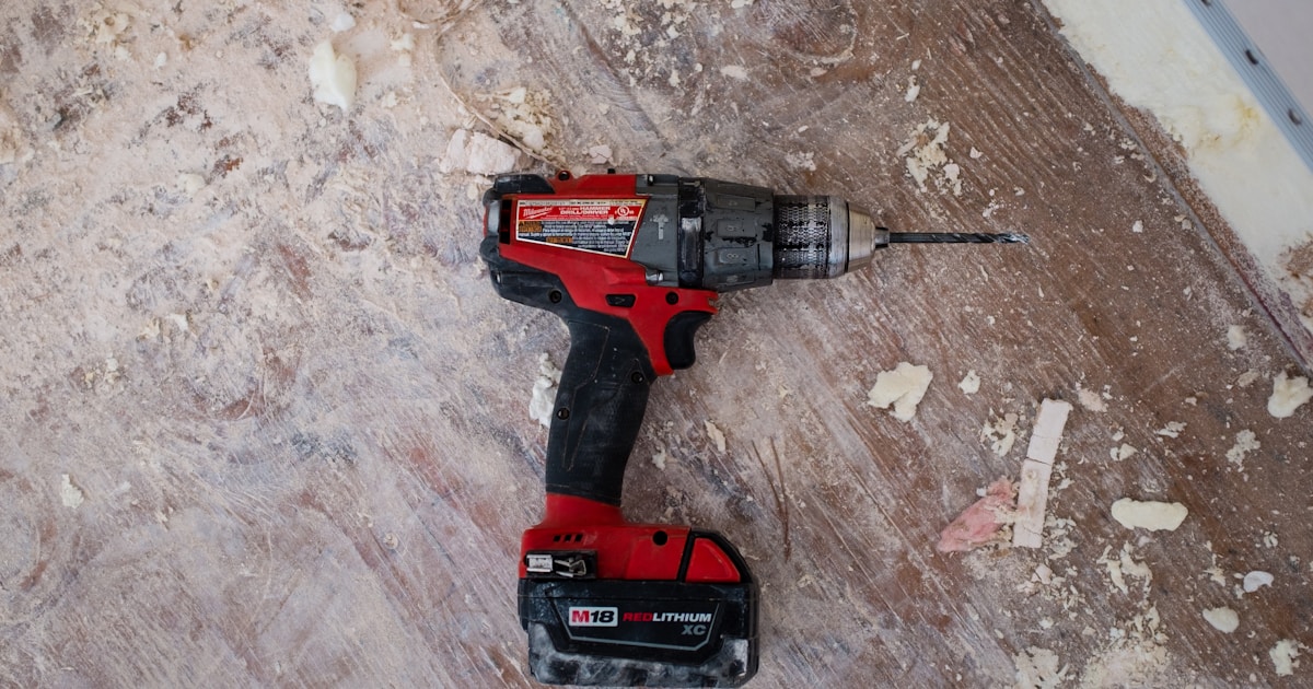Cordless power drills on a workshop bench